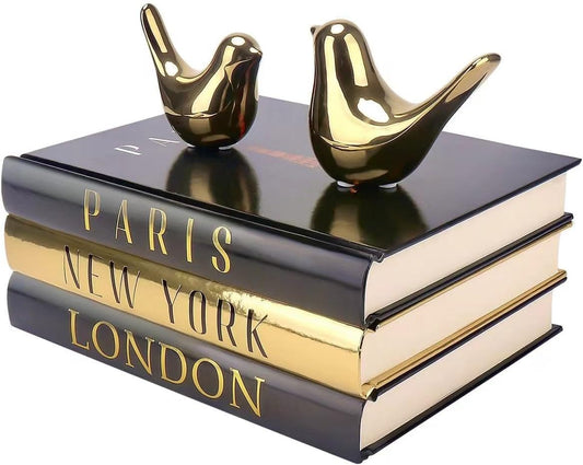 Black and Gold Decorative Books with Small Gold Bird Statues